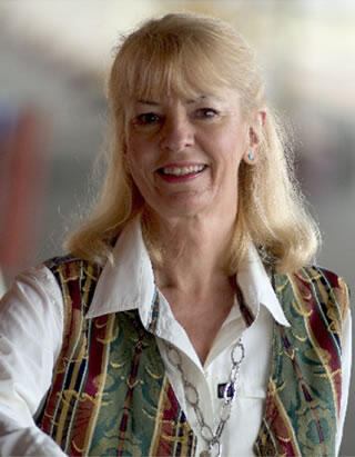 Woman with blond hair and brown eyes